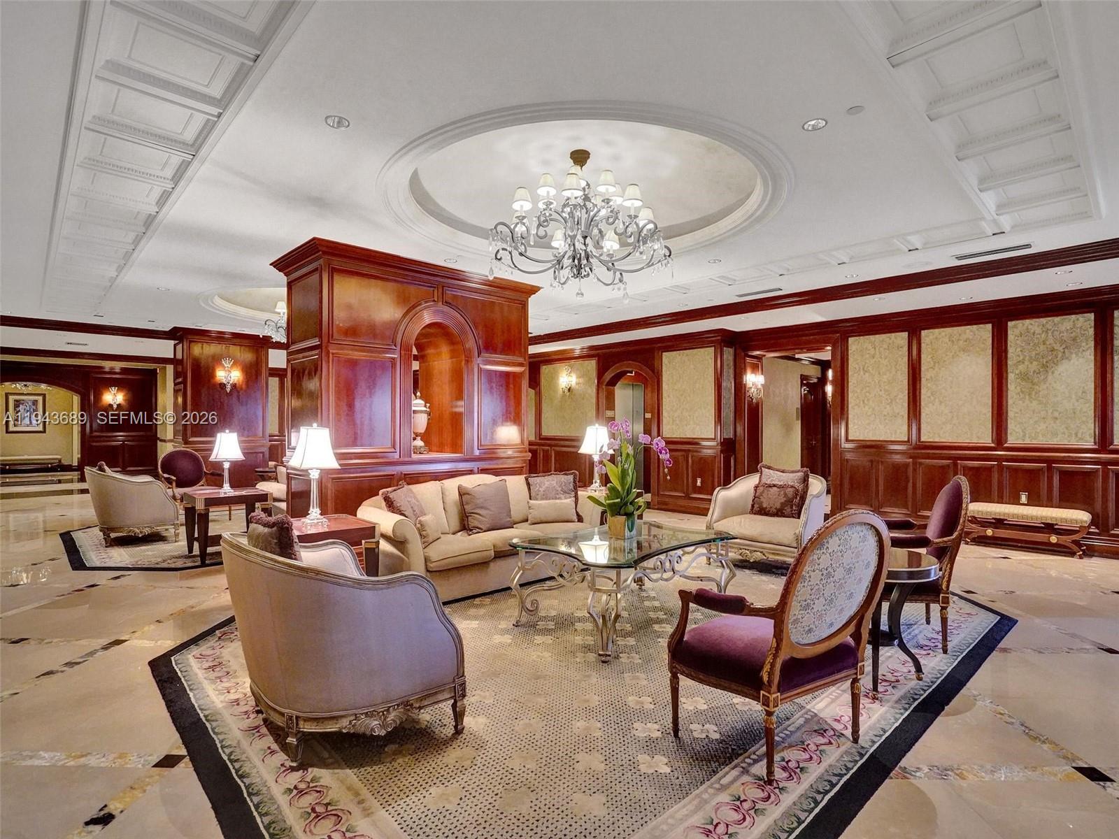 9595 Collins Avenue, Unit N8H Surfside, FL 33154 - Photo 26 of 35 a living room with furniture chandelier and large windows