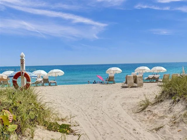 a view of entryway with a rug and a chandelier