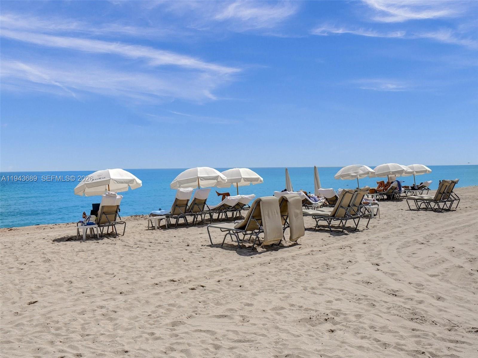 9595 Collins Avenue, Unit N8H Surfside, FL 33154 - Photo 32 of 35 a view of a terrace with chairs