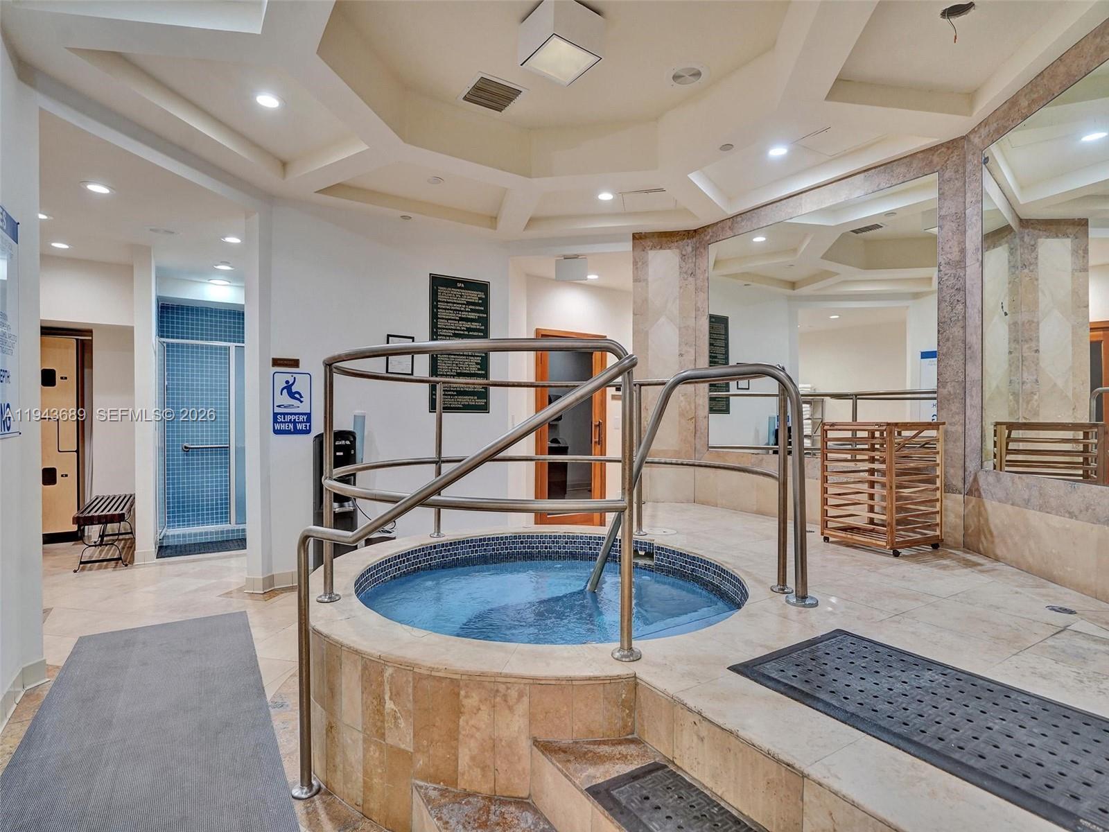 9595 Collins Avenue, Unit N8H Surfside, FL 33154 - Photo 33 of 35 a view of entryway with a rug and a chandelier