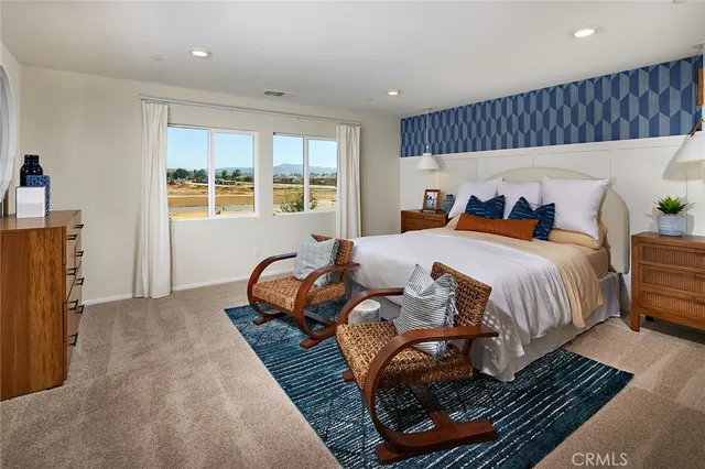 a bedroom with bed and a window