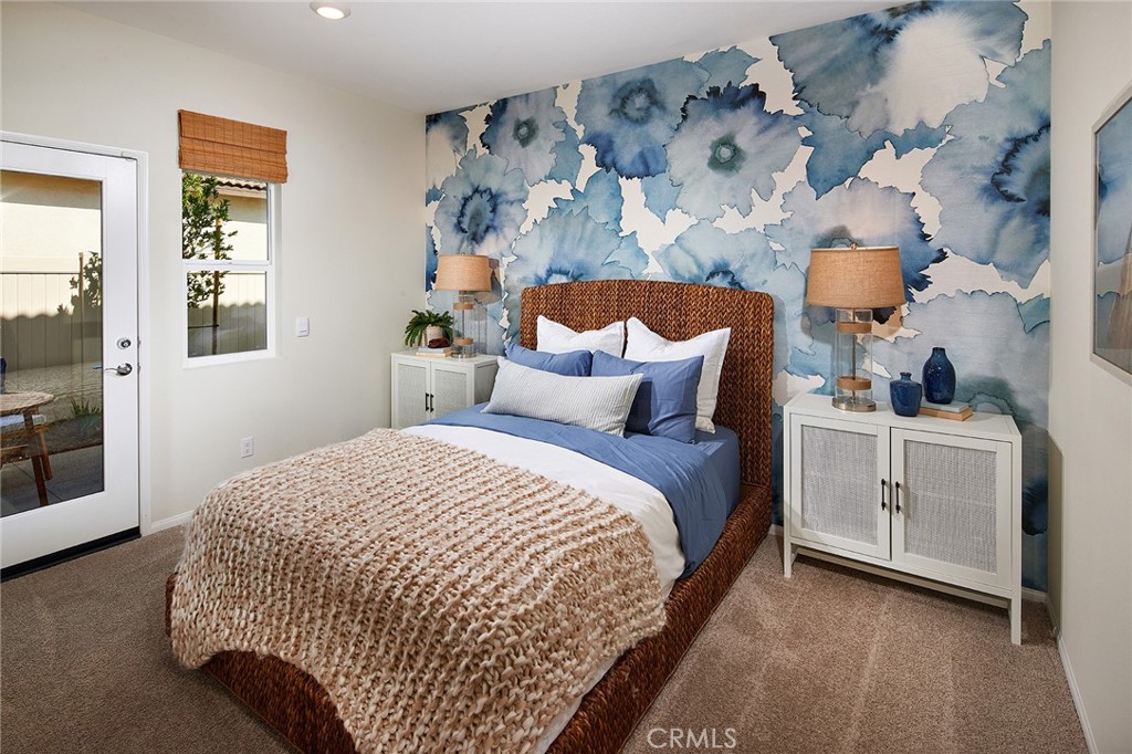 2039 Fernetta Place Perris, CA 92571 - Photo 13 of 22 a bedroom with bed and window