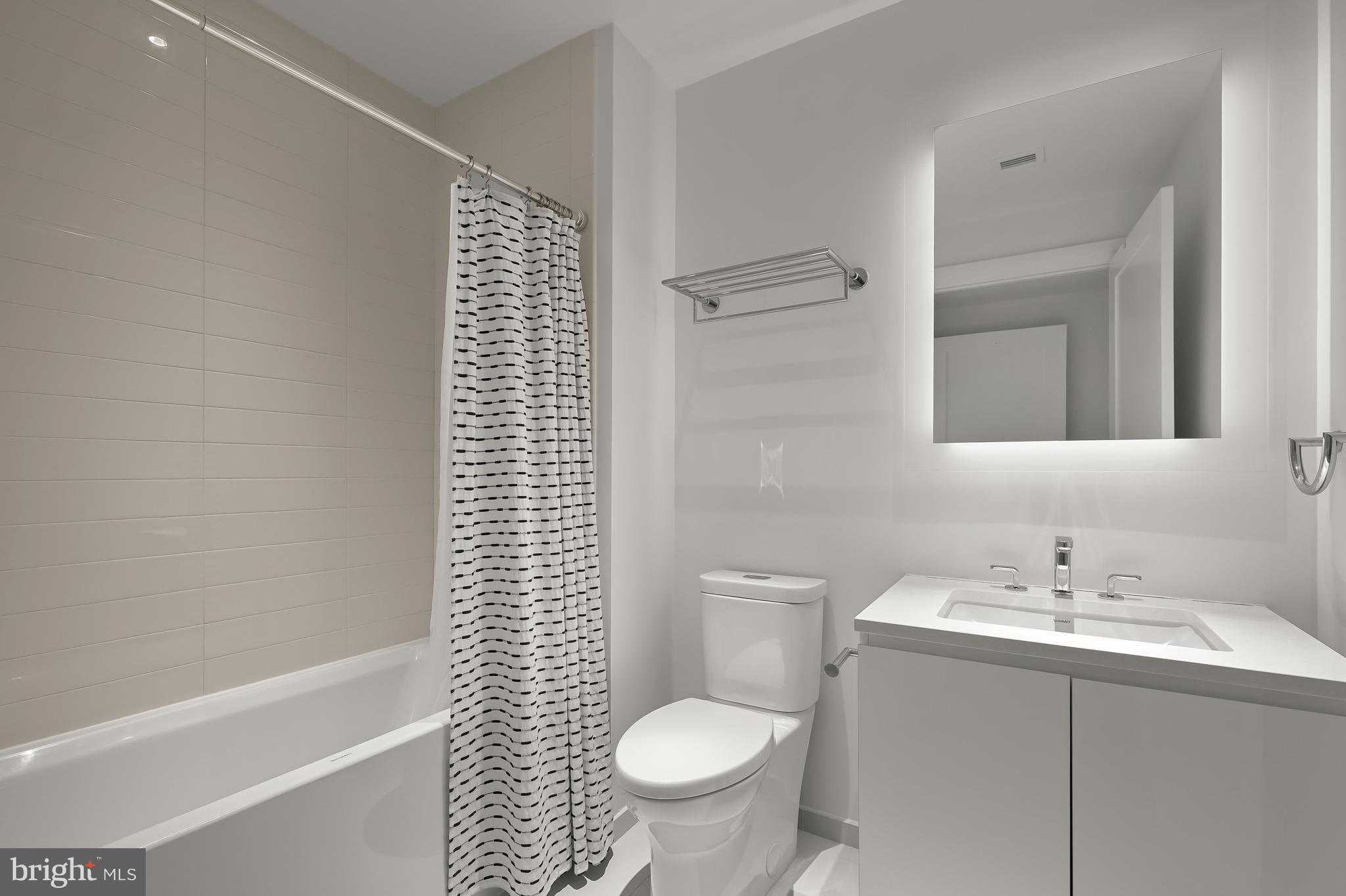 2501 M Street Northwest, Unit 311 Washington, DC 20037 - Photo 14 of 27 a bathroom with a sink toilet and shower