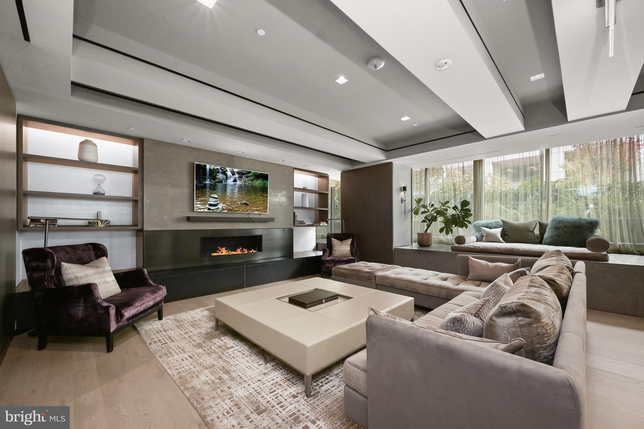 2501 M Street Northwest, Unit 311 Washington, DC 20037 - Photo 18 of 27 a living room with furniture and a fireplace