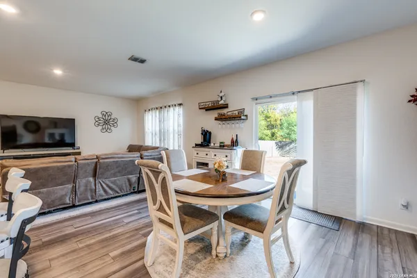 a dining room with furniture and window