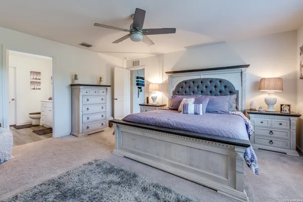a bedroom with a bed and a cabinets