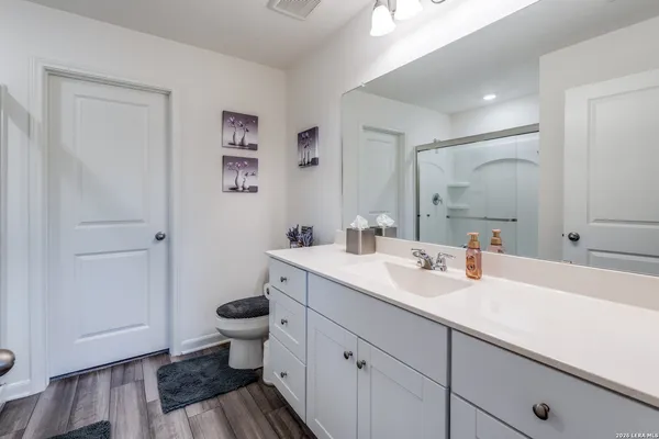 a view of bathroom with a sink and mirror
