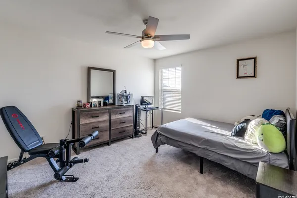 a bedroom with bed and a window
