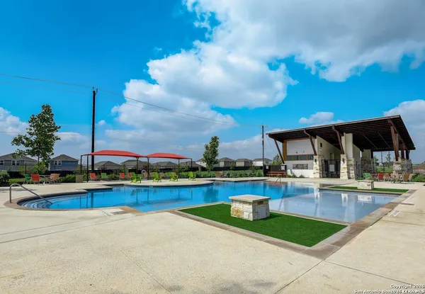 a view of a swimming pool with a patio
