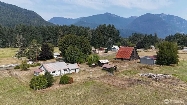 a view of a town with mountains in the background