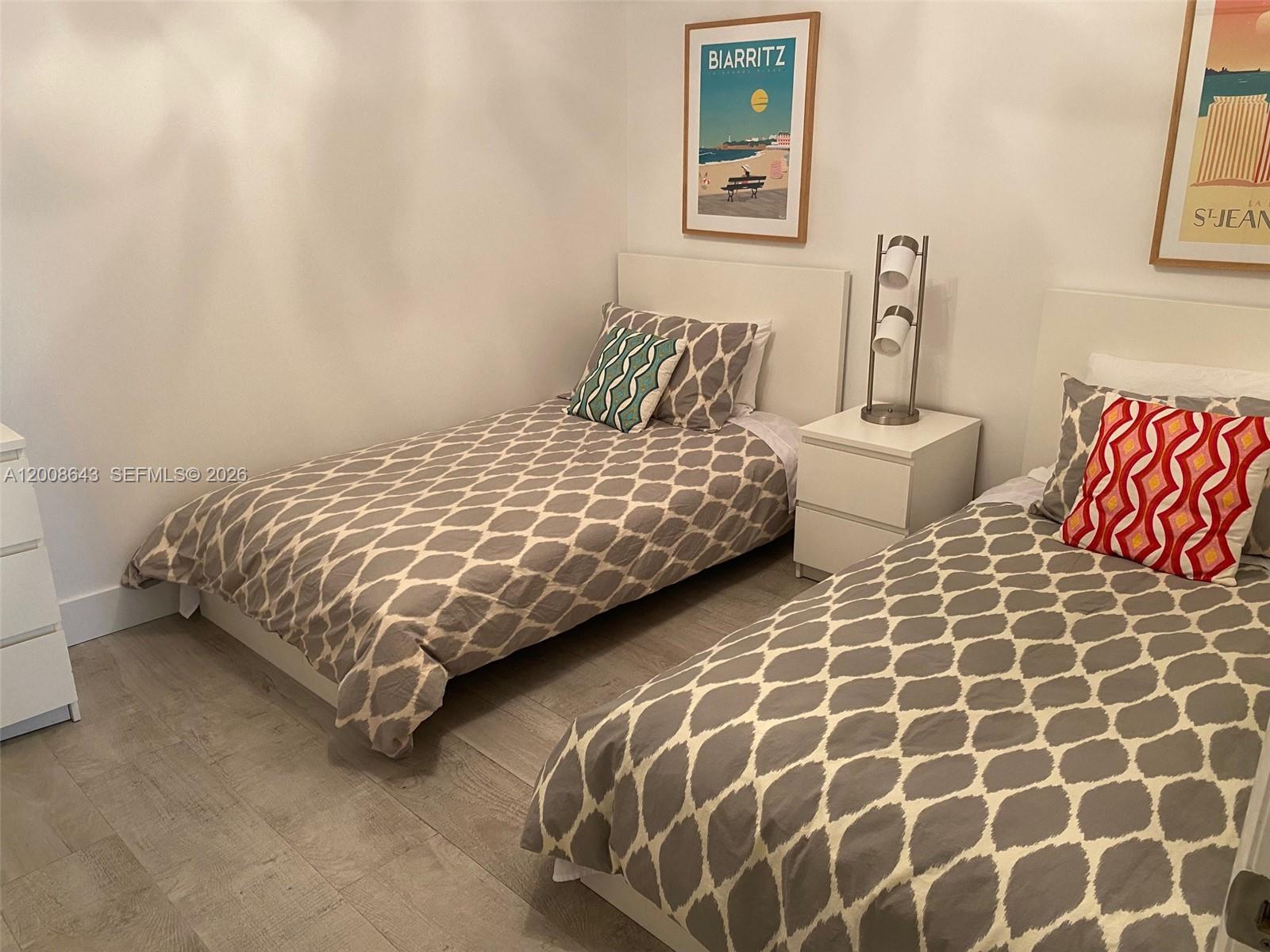 881 Ocean Drive, Unit TH12 Key Biscayne, FL 33149 - Photo 8 of 18 second bedroom with 2 single beds