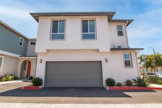 a front view of a house with yard