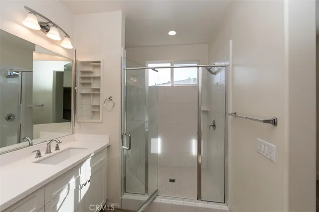 a bathroom with a sink and mirror