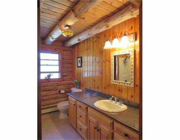 84 Searle Road Huntington, MA 01050 - Photo 11 of 28 a bathroom with a sink and a mirror