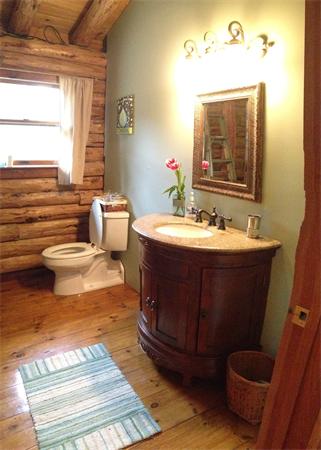 84 Searle Road Huntington, MA 01050 - Photo 17 of 28 a bathroom with a sink and a mirror