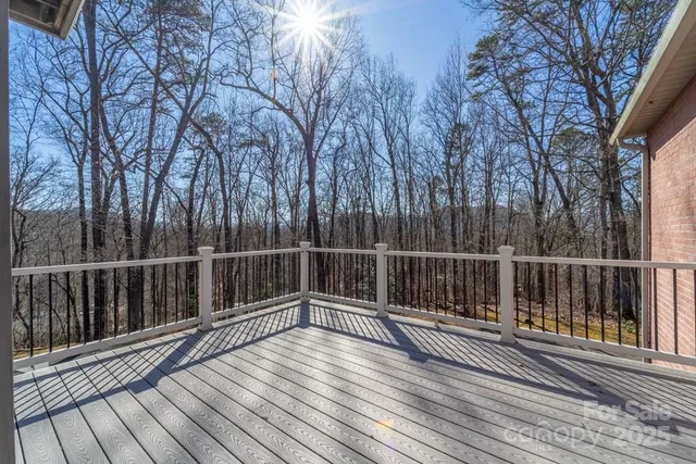 a view of deck with wooden floor and fence