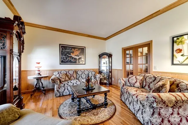 a living room with furniture window and wooden floor