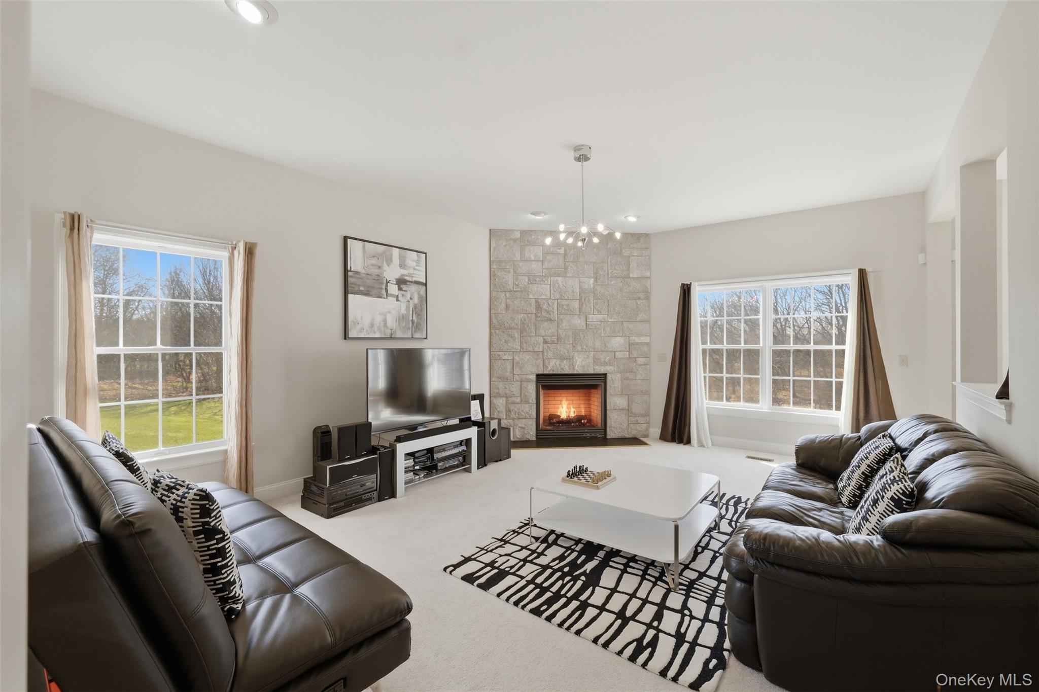 12 Feagles Road Warwick, NY 10990 - Photo 18 of 45 Family room with gas fireplace and plenty of natural light
