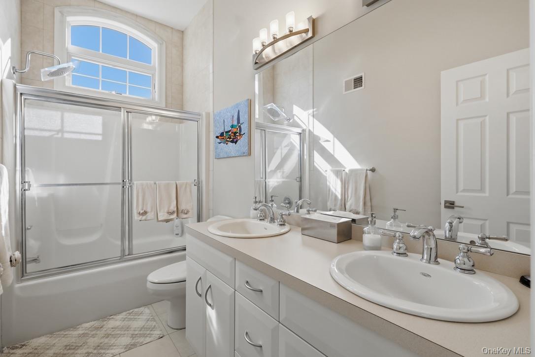 12 Feagles Road Warwick, NY 10990 - Photo 25 of 45 This full bathroom offers a double-sink vanity, tub and shower.