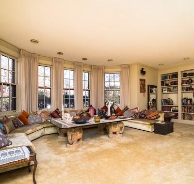 5420 Darlington Road Pittsburgh, PA 15217 - Photo 13 of 25 The living room is surrounded by wall sized windows and built in book cases.