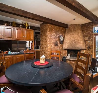 5420 Darlington Road Pittsburgh, PA 15217 - Photo 7 of 25 The kitchen eating area has a wood burning fireplace making it a cozy place to hang out.