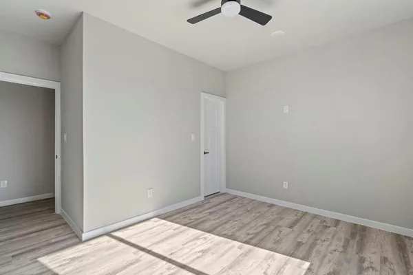 a view of an empty room and a window