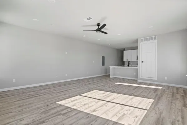 a kitchen with granite countertop a sink and a stove top oven