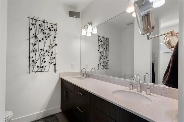 a bathroom with a double vanity sink mirror and double