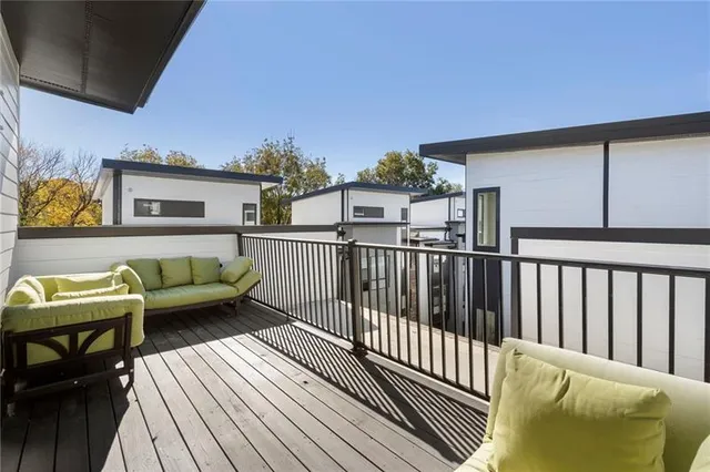 a view of a balcony with furniture