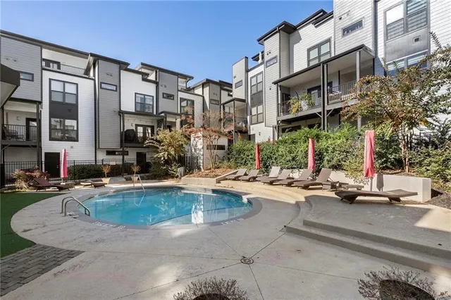 a view of a building with cars park