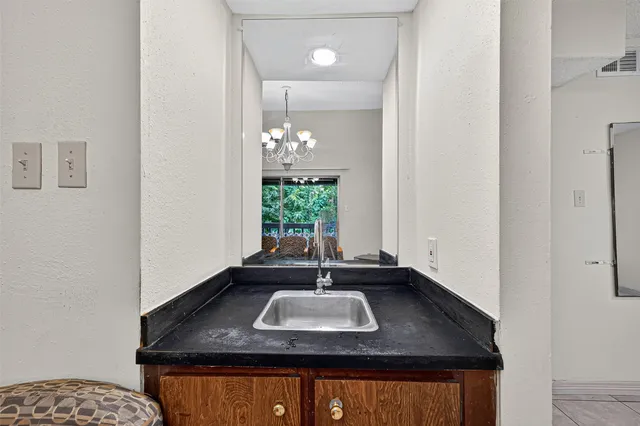 a living room with patio furniture and a fireplace
