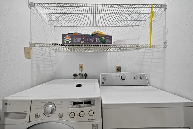 a view of a bathroom with a glass door and shower