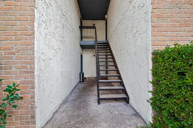 a view of a pathway with a white door