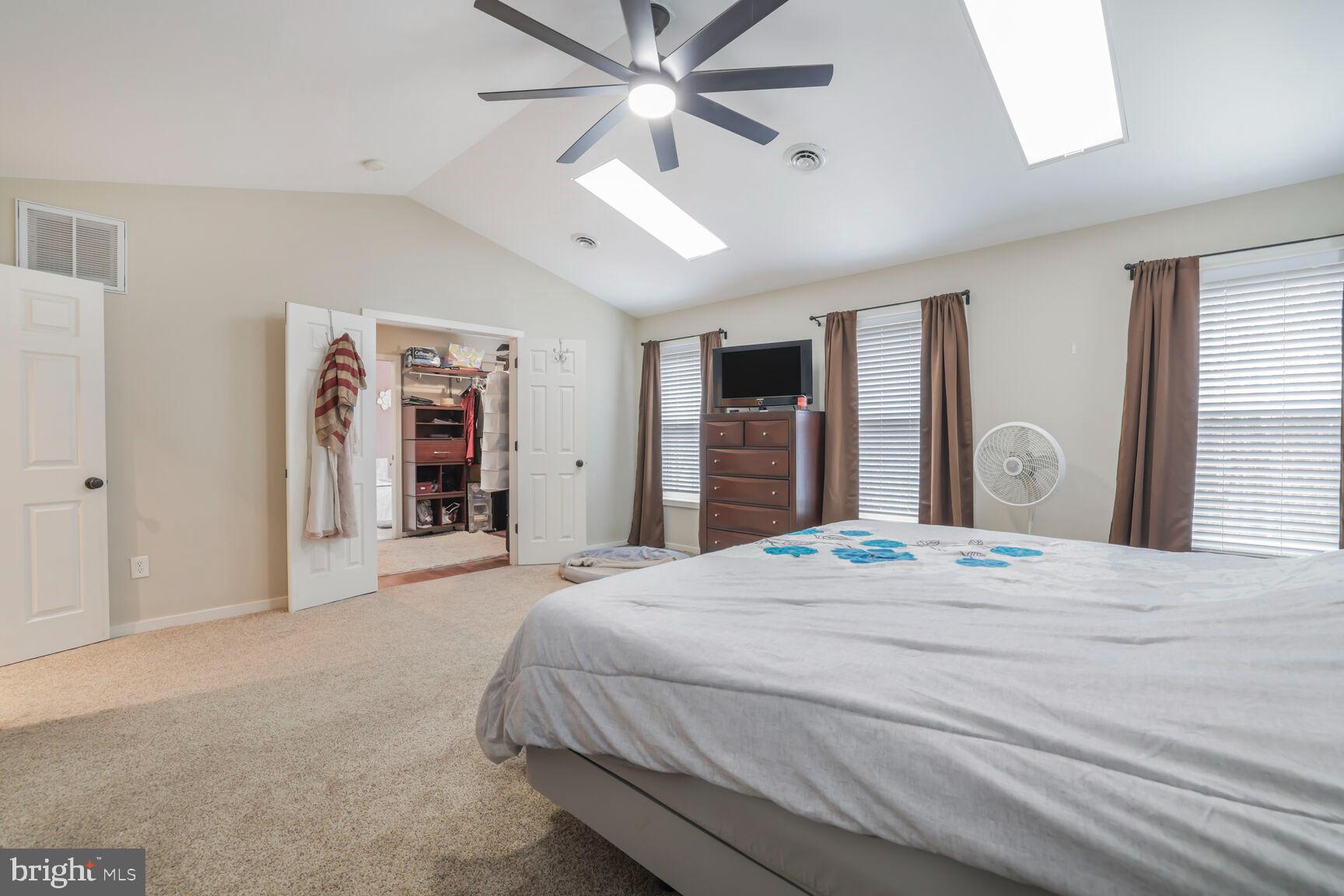 6231 Woodville Road Mount Airy, MD 21771 - Photo 15 of 29 a spacious bedroom with a large bed and a dresser