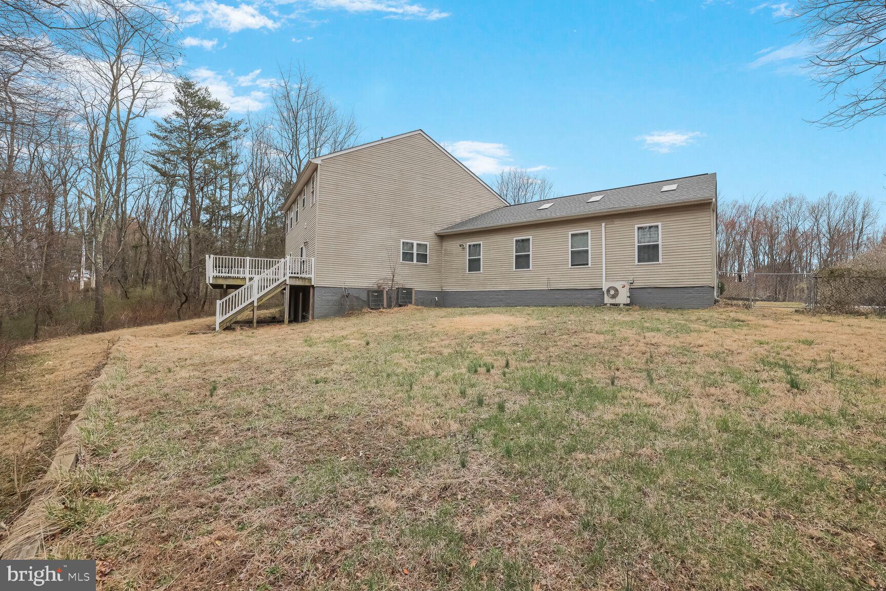 6231 Woodville Road Mount Airy, MD 21771 - Photo 27 of 29 a view of a house with a yard
