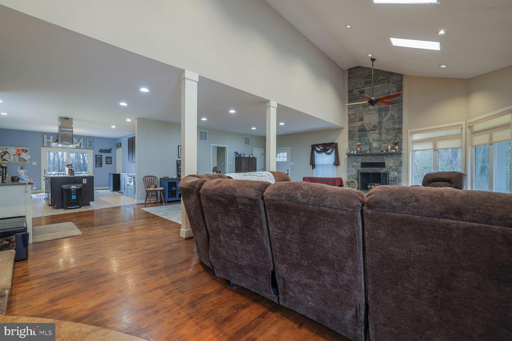 6231 Woodville Road Mount Airy, MD 21771 - Photo 4 of 29 a living room with furniture and a fireplace