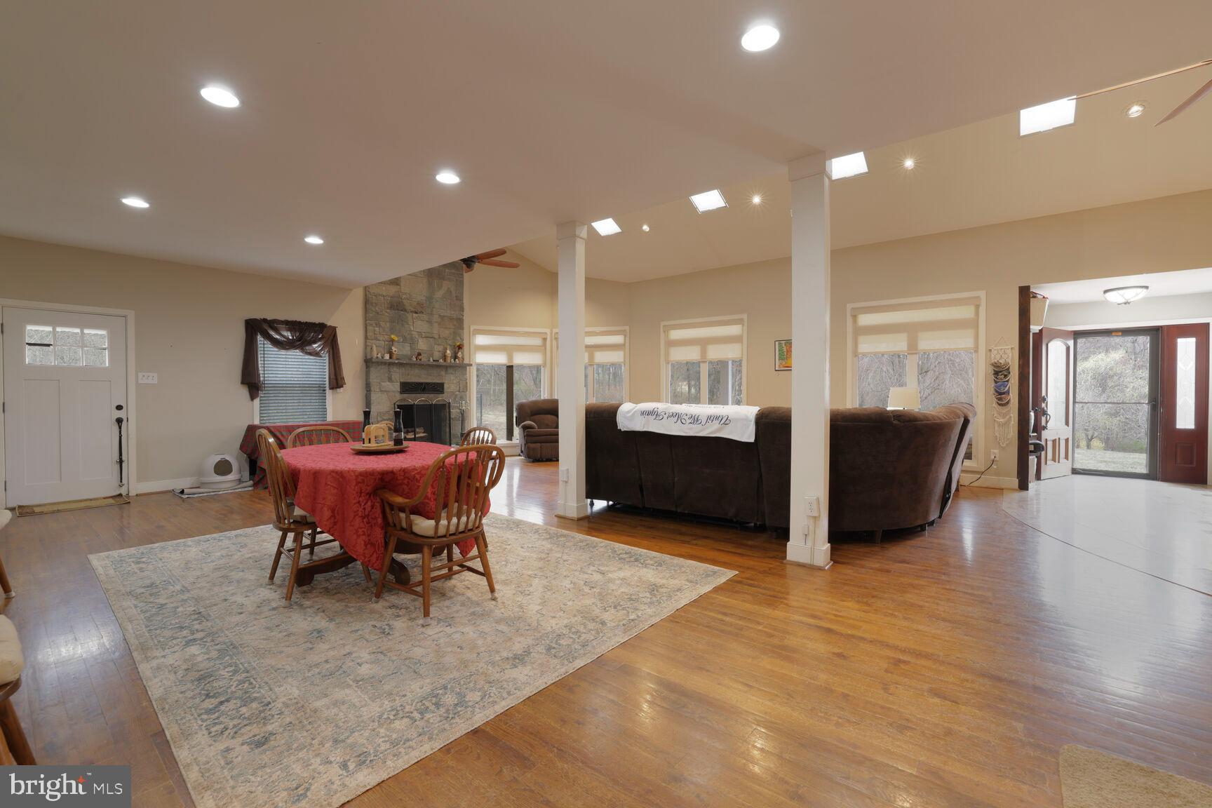 6231 Woodville Road Mount Airy, MD 21771 - Photo 5 of 29 a living room with furniture a dining table and kitchen view