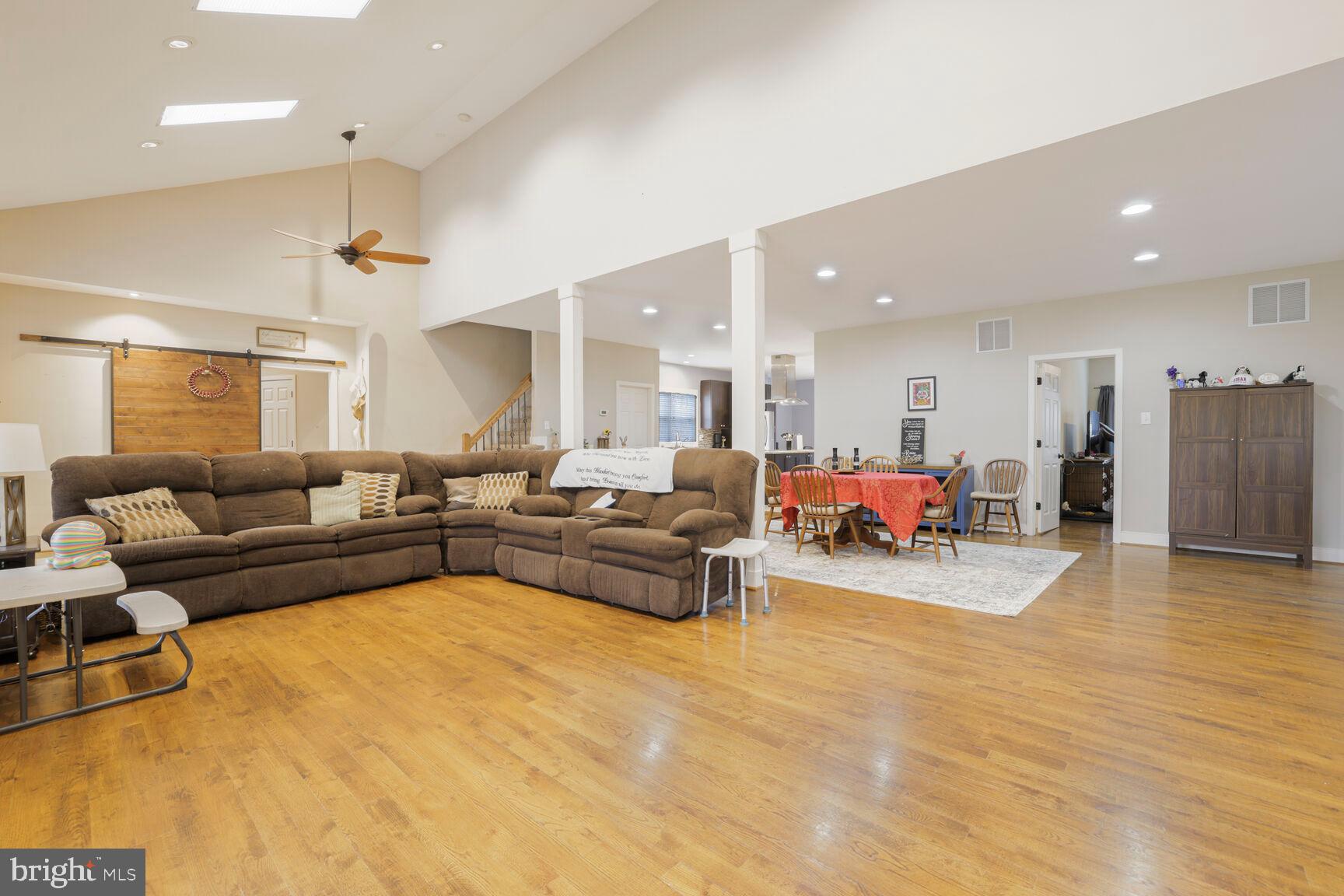 6231 Woodville Road Mount Airy, MD 21771 - Photo 7 of 29 a living room with furniture and kitchen view