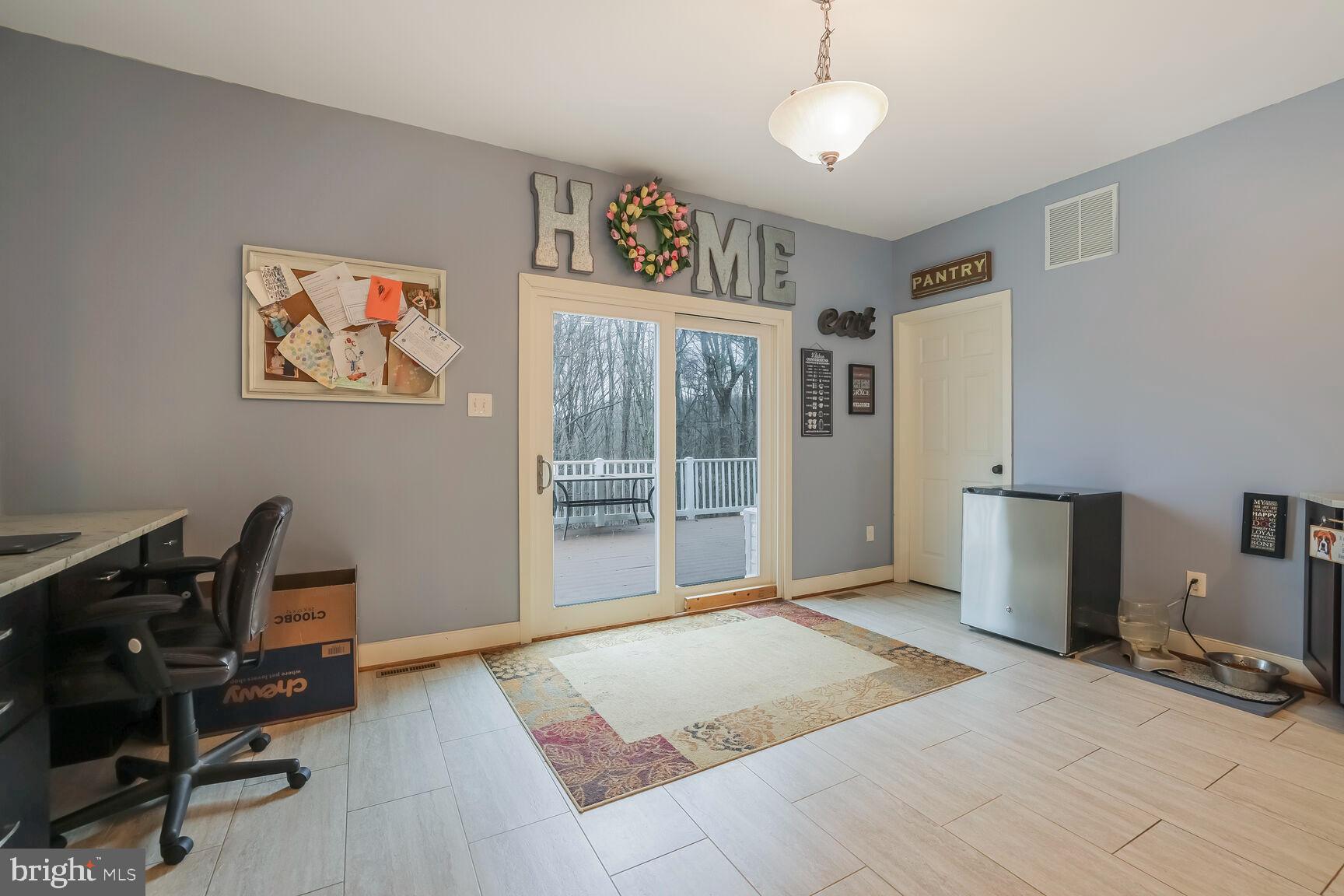 6231 Woodville Road Mount Airy, MD 21771 - Photo 10 of 29 a view of a workspace with furniture and a window