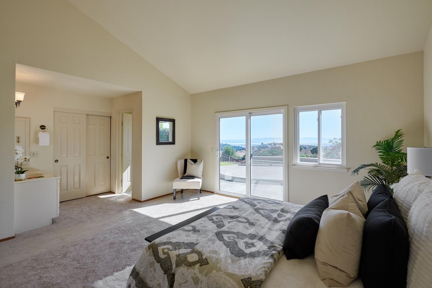 2516 Sherborne Drive Belmont, CA 94002 - Photo 13 of 25 a bedroom with a bed and large windows