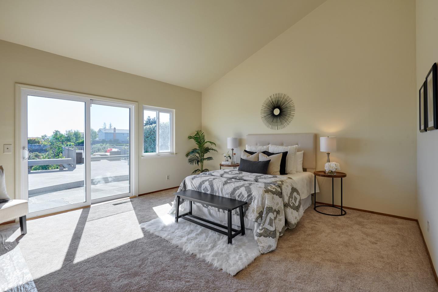2516 Sherborne Drive Belmont, CA 94002 - Photo 14 of 25 a bedroom with a bed and glass door