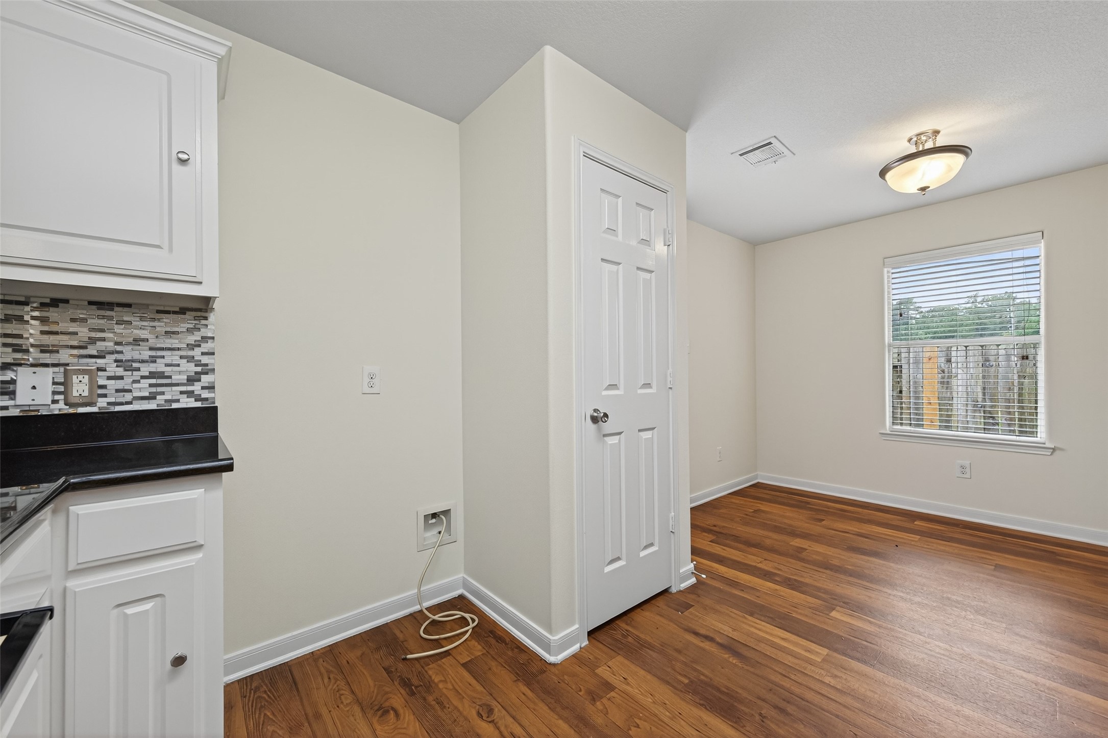 4107 Pedernales River Lane Spring, TX 77386 - Photo 18 of 33 a view of an empty room with wooden floor and a window