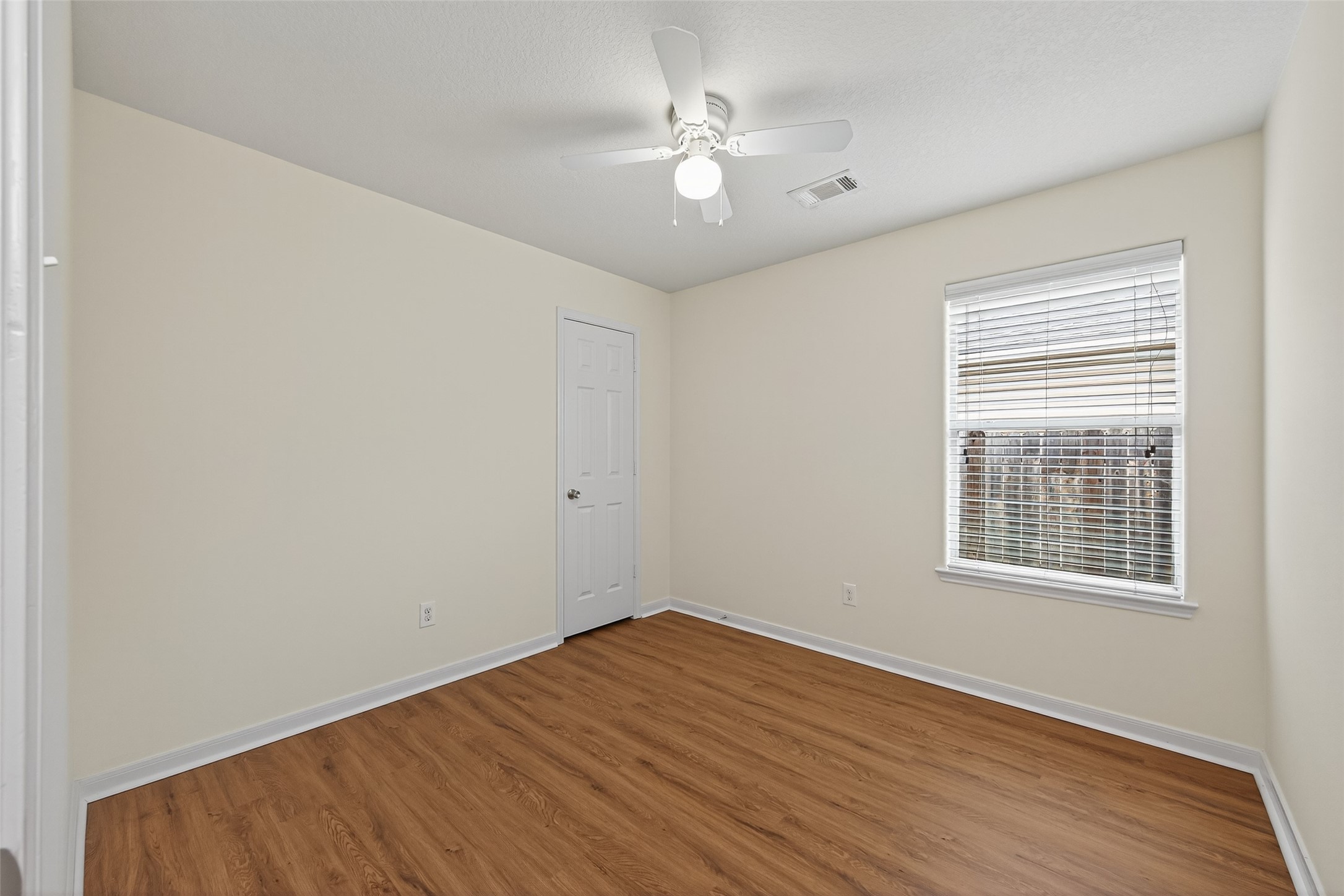 4107 Pedernales River Lane Spring, TX 77386 - Photo 26 of 33 wooden floor in an empty room with a window