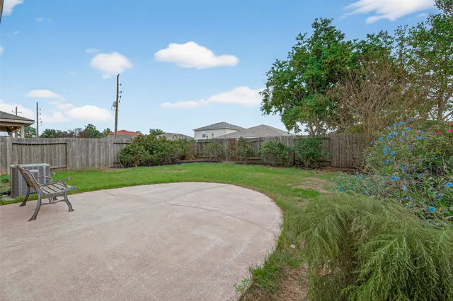 a view of a table and chairs in the garden