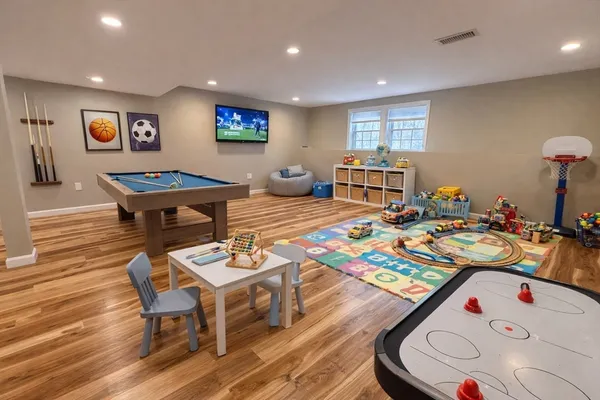 a bed room with furniture and wooden floor