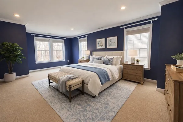 a spacious bedroom with a large bed and a couch