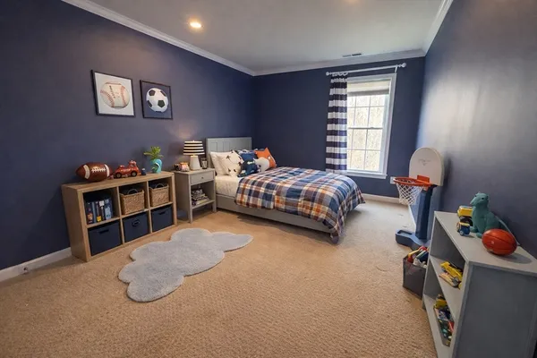 a bedroom with bed and a window