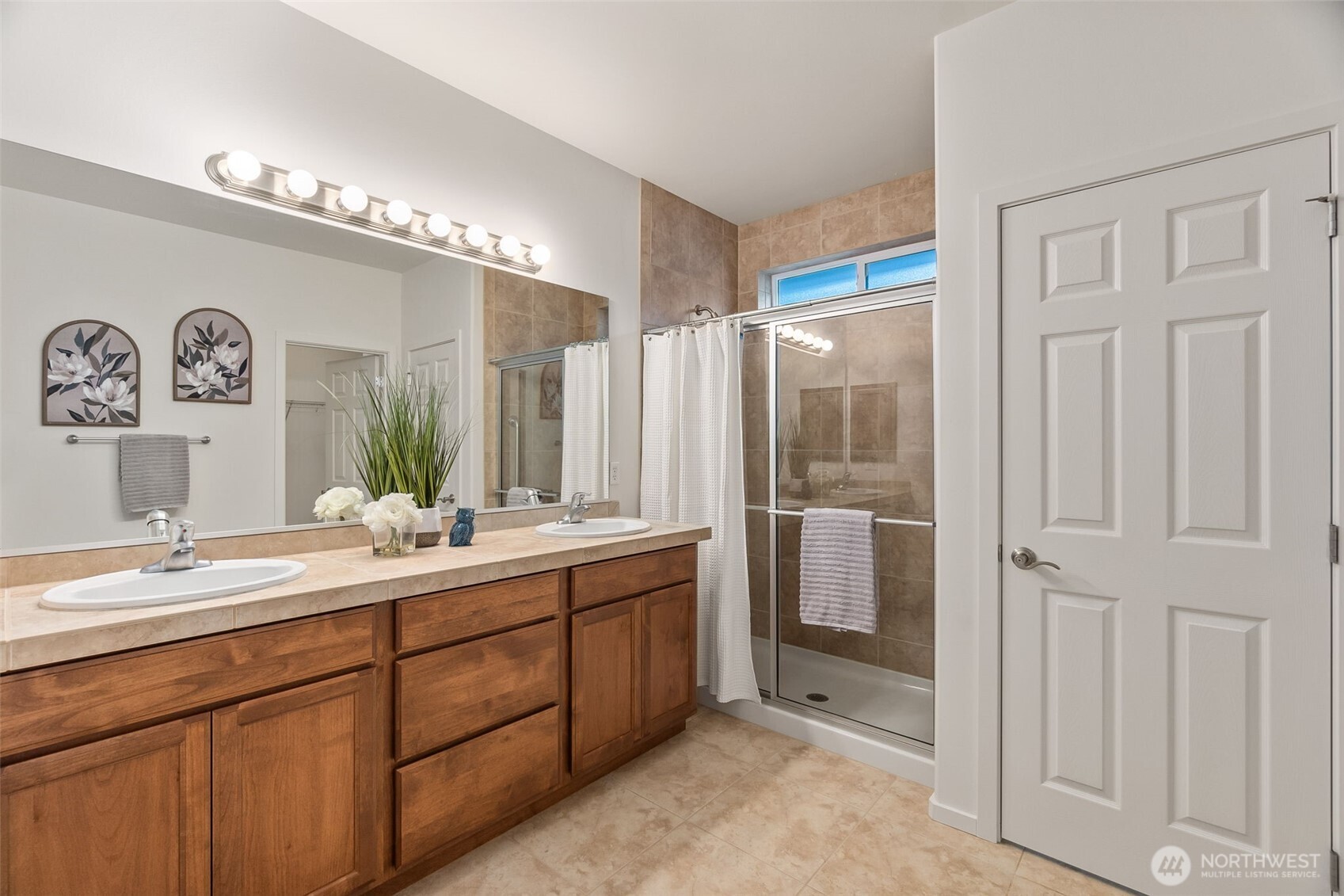 8231 Orcas Loop Northeast Lacey, WA 98516 - Photo 12 of 23 a bathroom with a double vanity sink and mirror