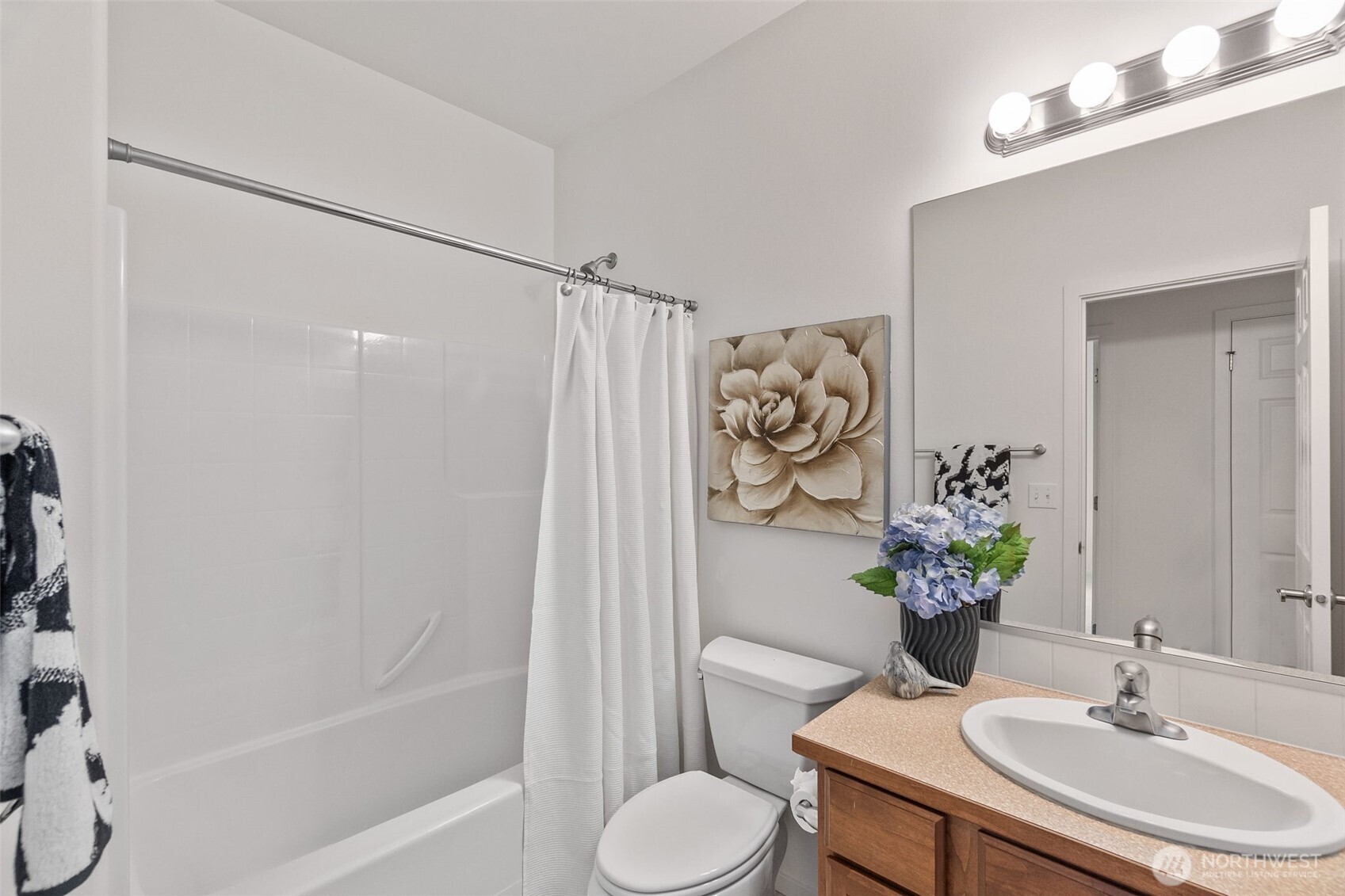 8231 Orcas Loop Northeast Lacey, WA 98516 - Photo 14 of 23 a bathroom with a sink toilet and shower