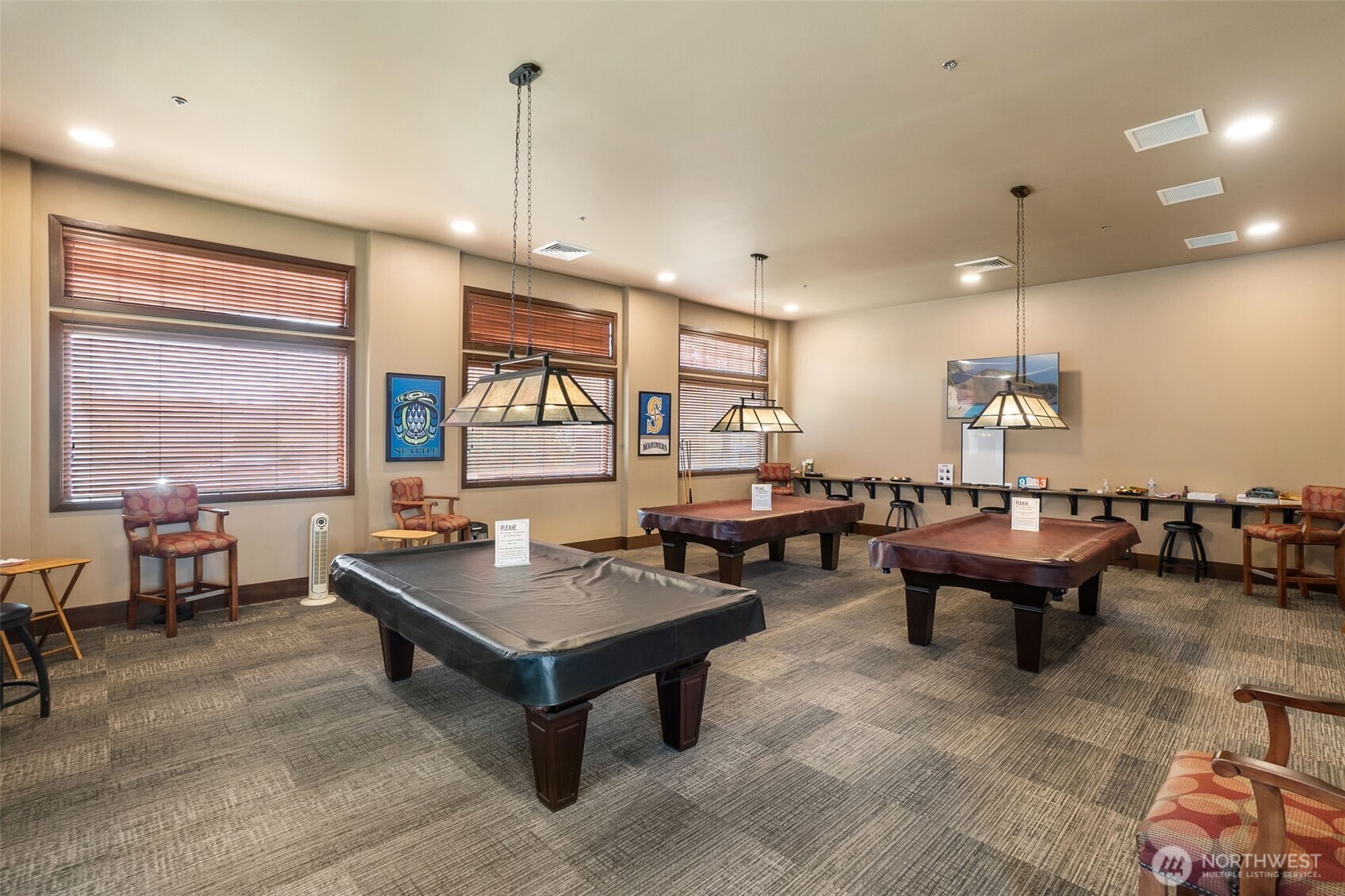 8231 Orcas Loop Northeast Lacey, WA 98516 - Photo 20 of 23 a living room with furniture a large window and a chandelier